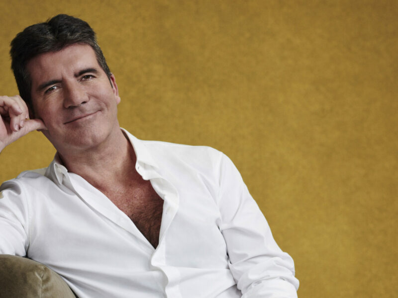 Simon Cowell: A Multi-Talented British TV Host, Journalist, Producer, and Philanthropist